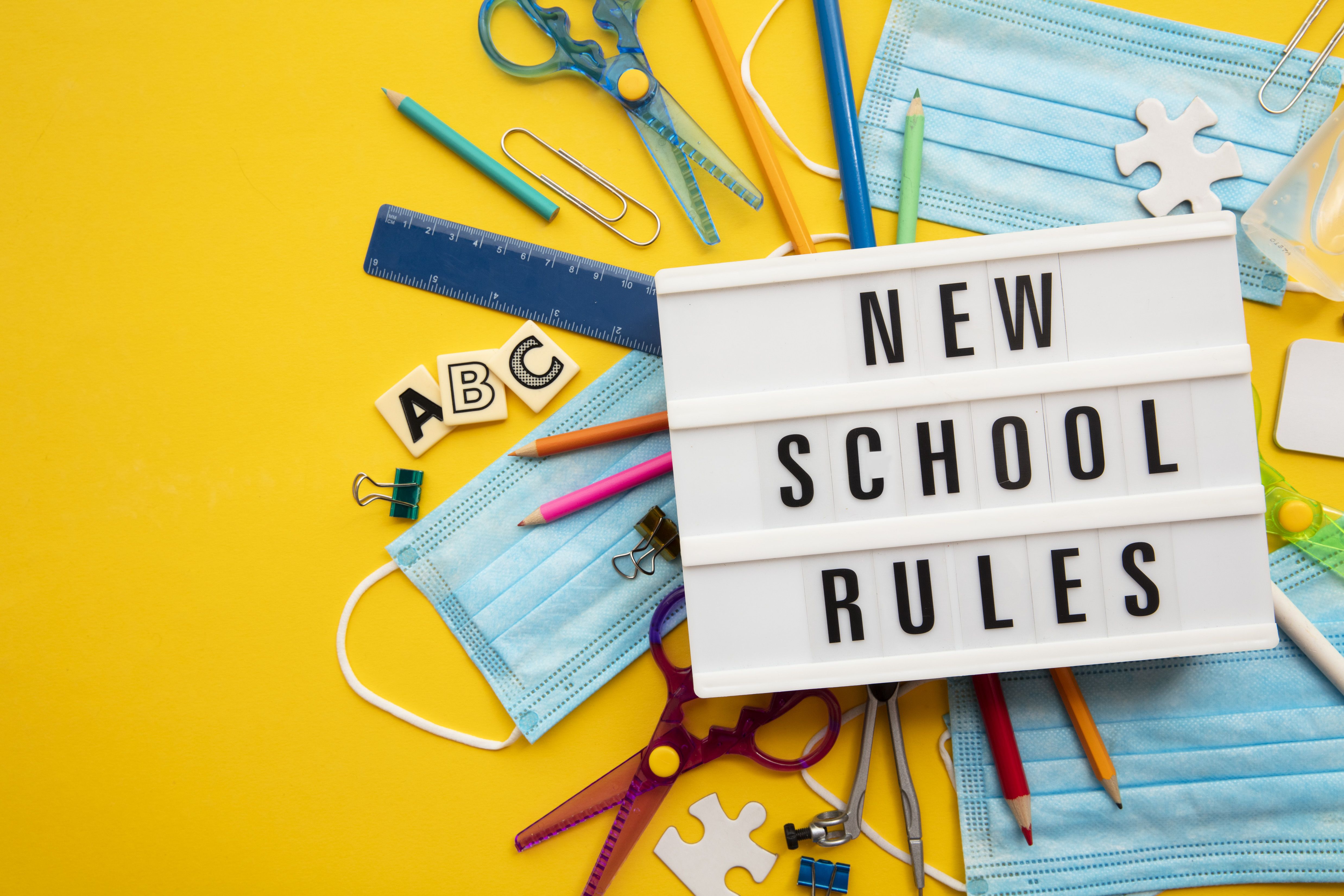 new school rules message with school equipment covid masks